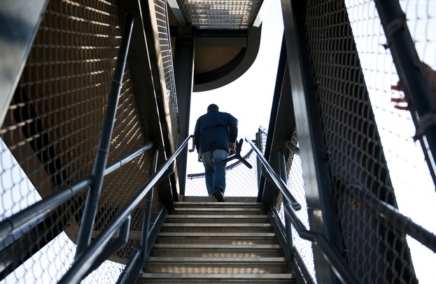 Michigan Marching Band Director Scott Boerma walks up the structure at Elbel Field to conduct practice on Thursday. Daniel Brenner I AnnArbor.com